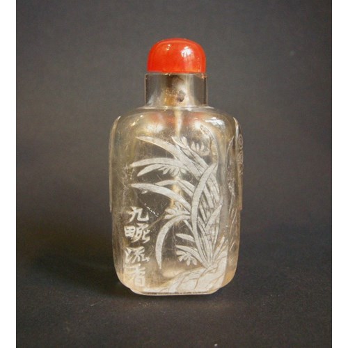 Rock crystal snuff bottle sculpted in the white with flowers reeds